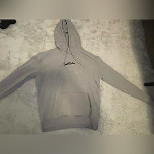 Has a few light bleach spots on the back and sleeve front is stainless